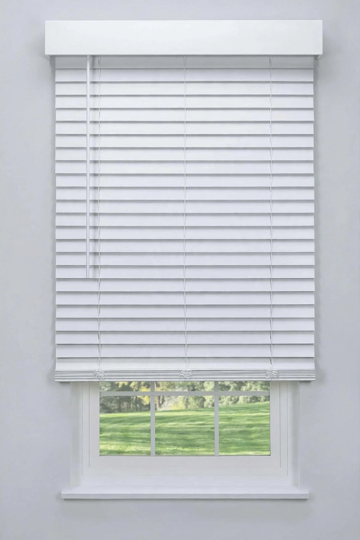 Faux wood blind with modern flat valance on gray wall